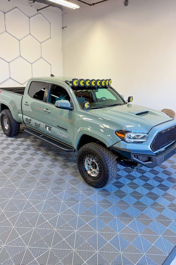 Sage-green Toyota Tacoma gleaming after a full detail — exterior