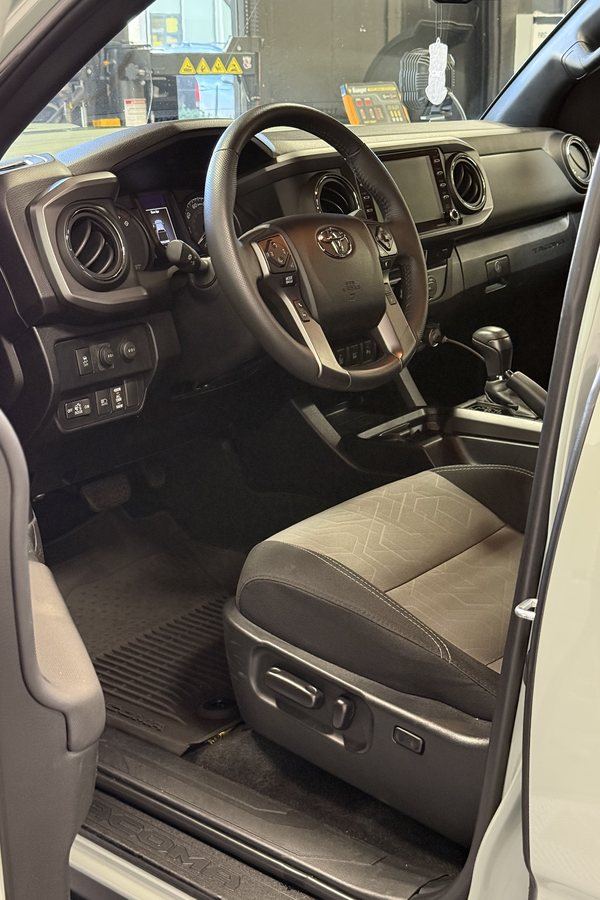 Spotless Toyota Tacoma cabin after a full detail — dash, steering wheel, and seats