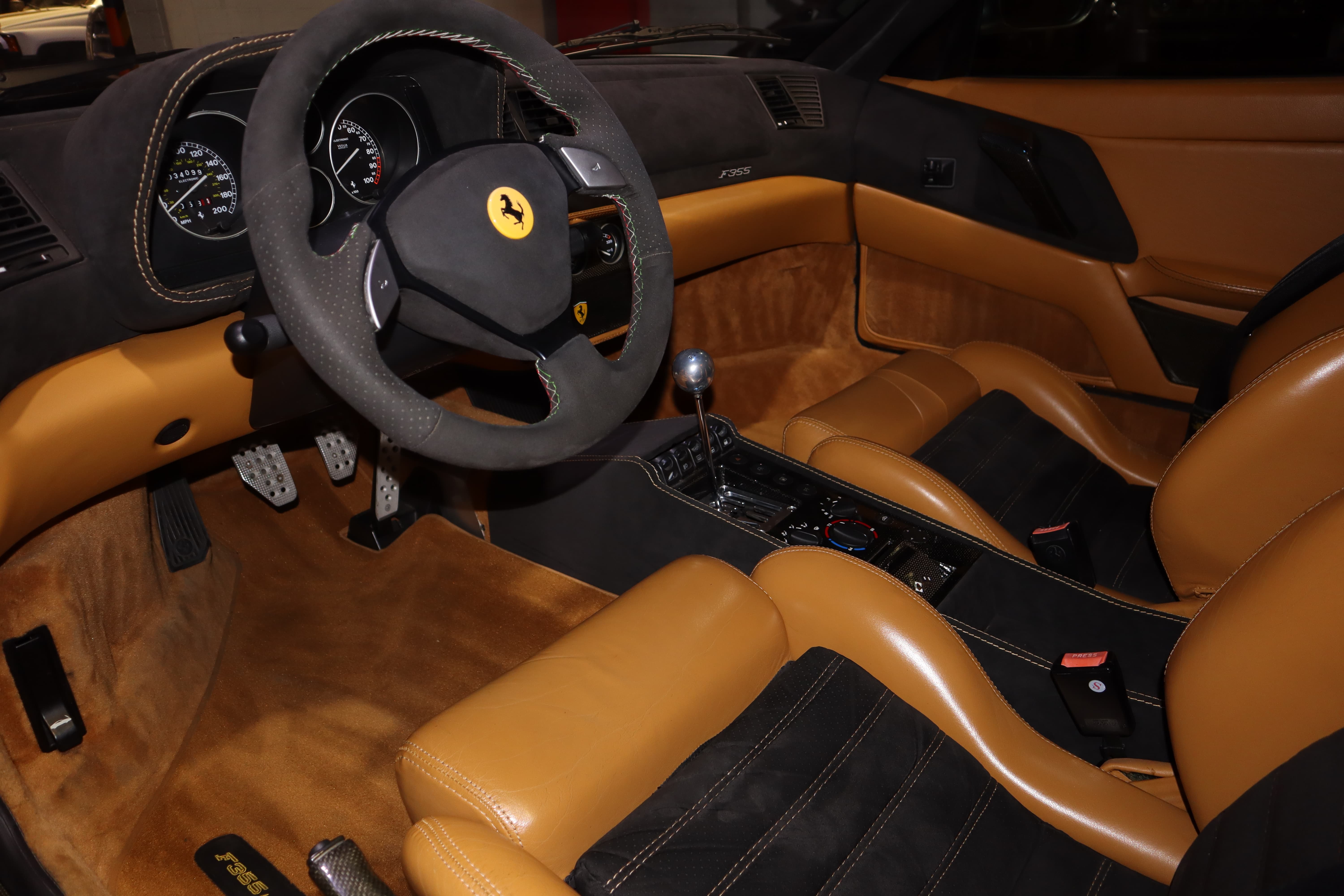 Pristine tan leather interior of a Range Rover after full detail service